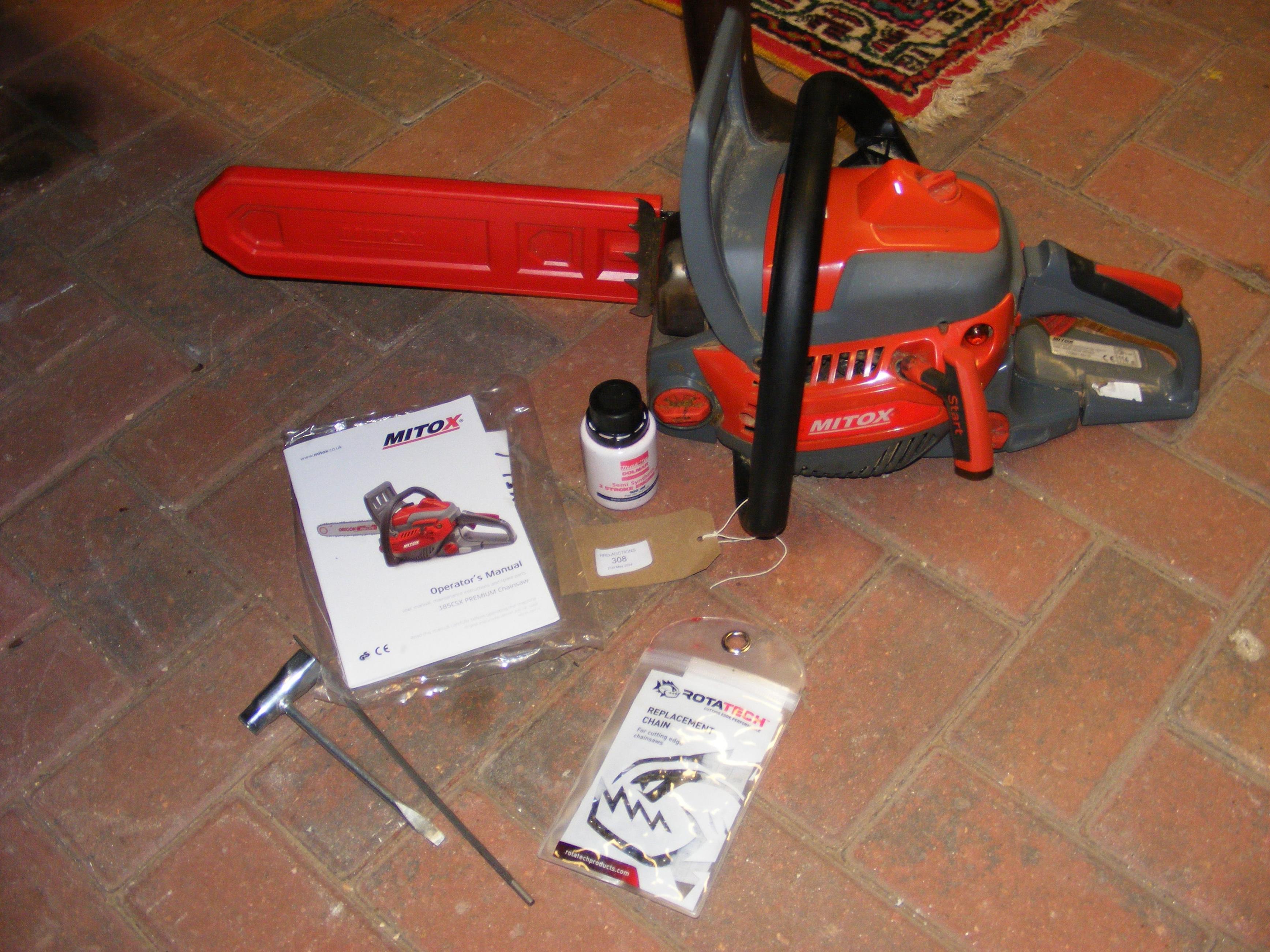 A Mitox 385CSX Premium Chainsaw and accessories