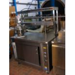 A stainless steel commercial hot cupboard with heated gantry above