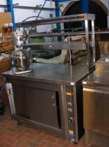 A stainless steel commercial hot cupboard with heated gantry above