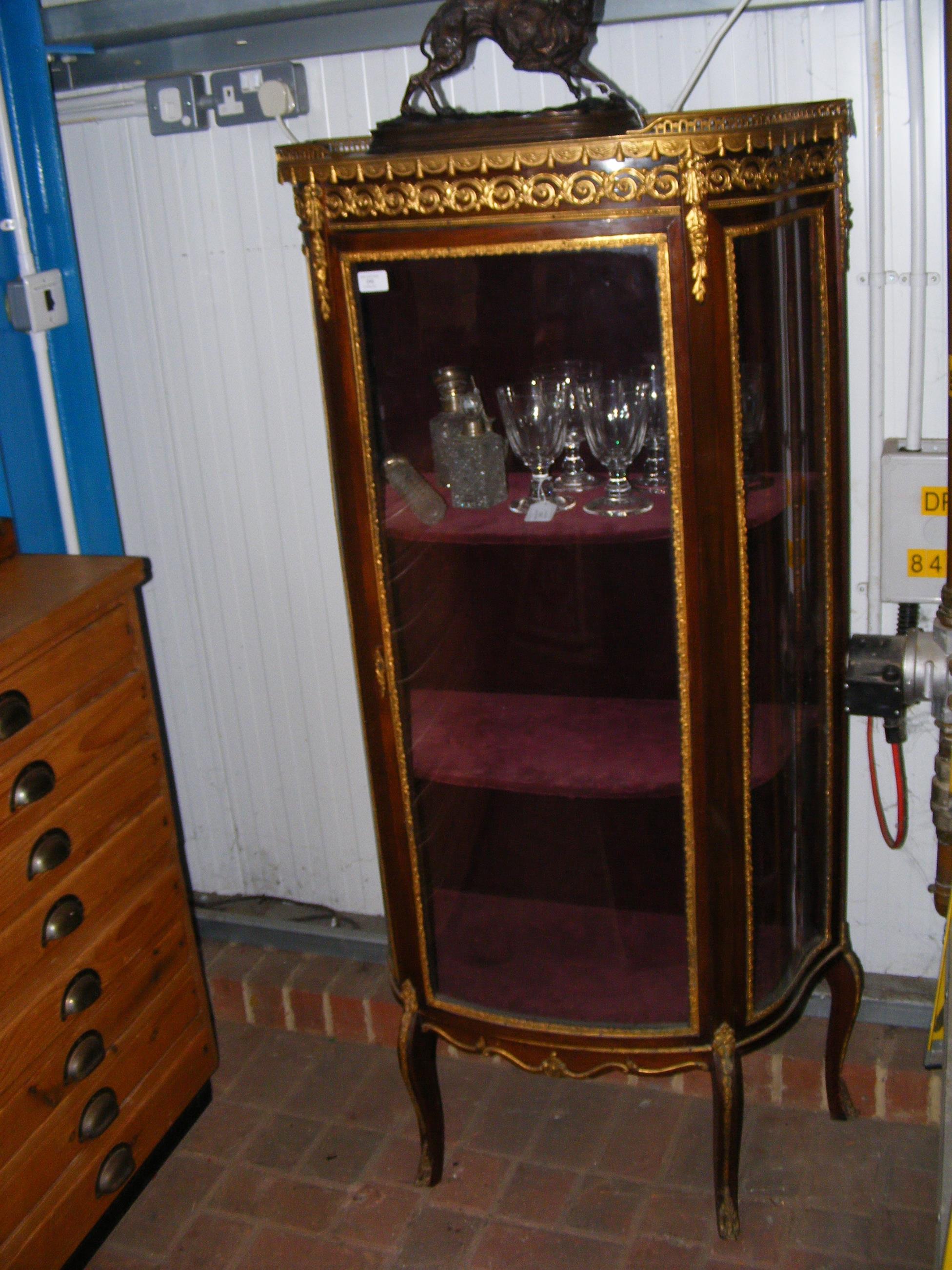 A reproduction French display cabinet