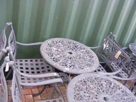 A black and metal bistro garden table with two cha