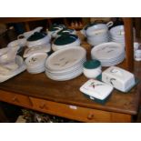A quantity of Denby Greenwheat pattern kitchen and
