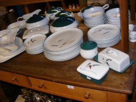 A quantity of Denby Greenwheat pattern kitchen and