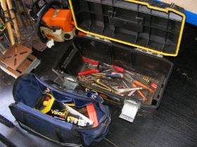 A toolbox and tool bag containing useful tools