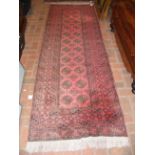 A Middle Eastern style runner with geometric borde