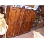 A bank of 5 antique pine golf or sports locker room lockers - width 148cm