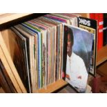 A collection of vinyl LP records, including Supert