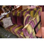 A modern Knoll style settee upholstered in stripe