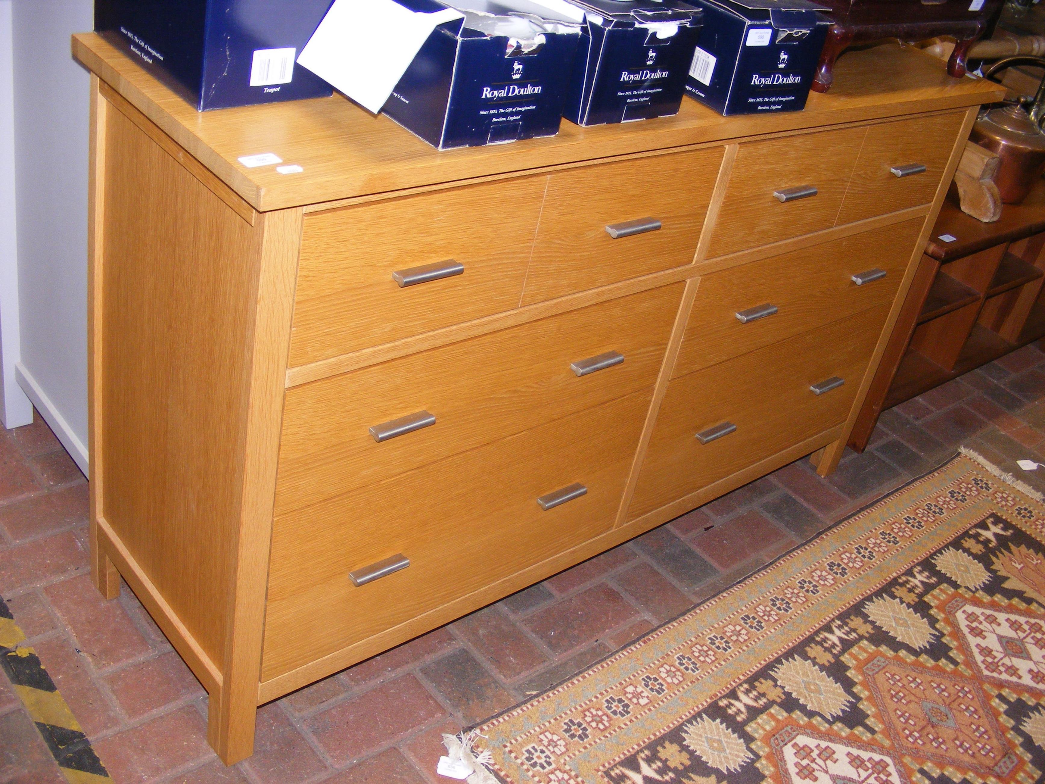 A contemporary light oak G-Plan double width chest