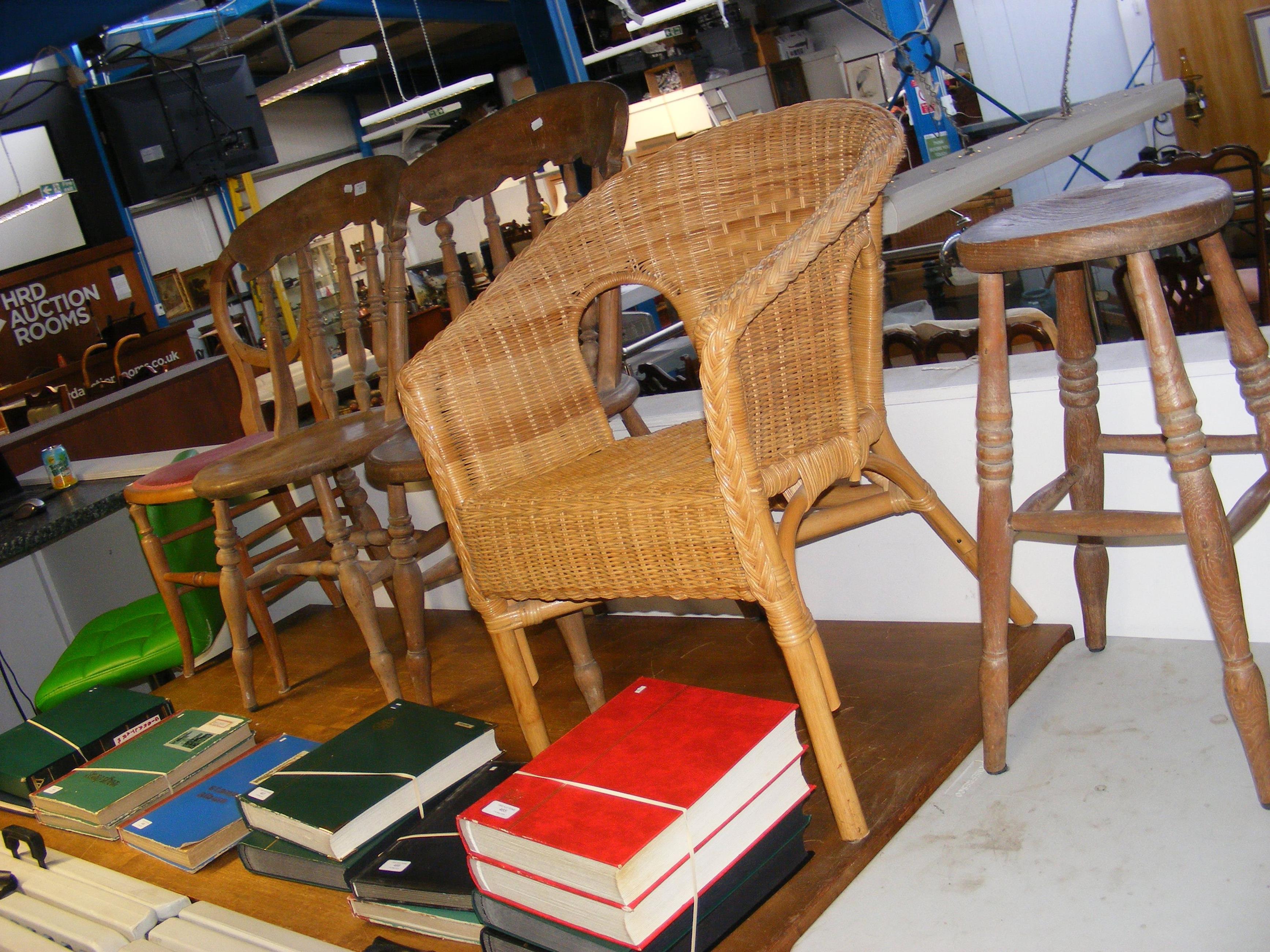 A selection of old chairs and stools, including ca