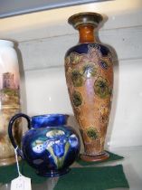 A Moorcroft Pottery jug, together with a Doulton s