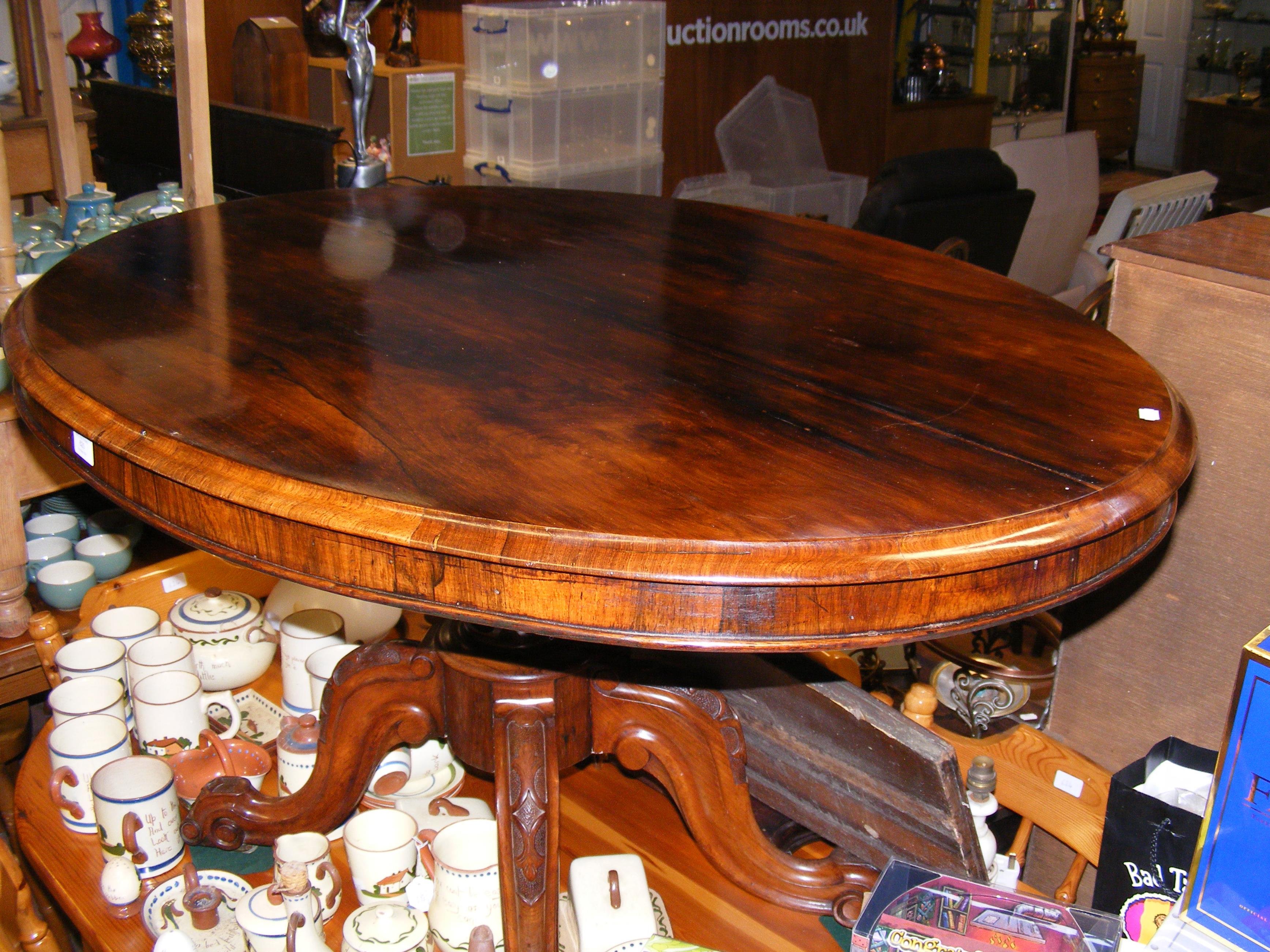 A 19th century rosewood breakfast table