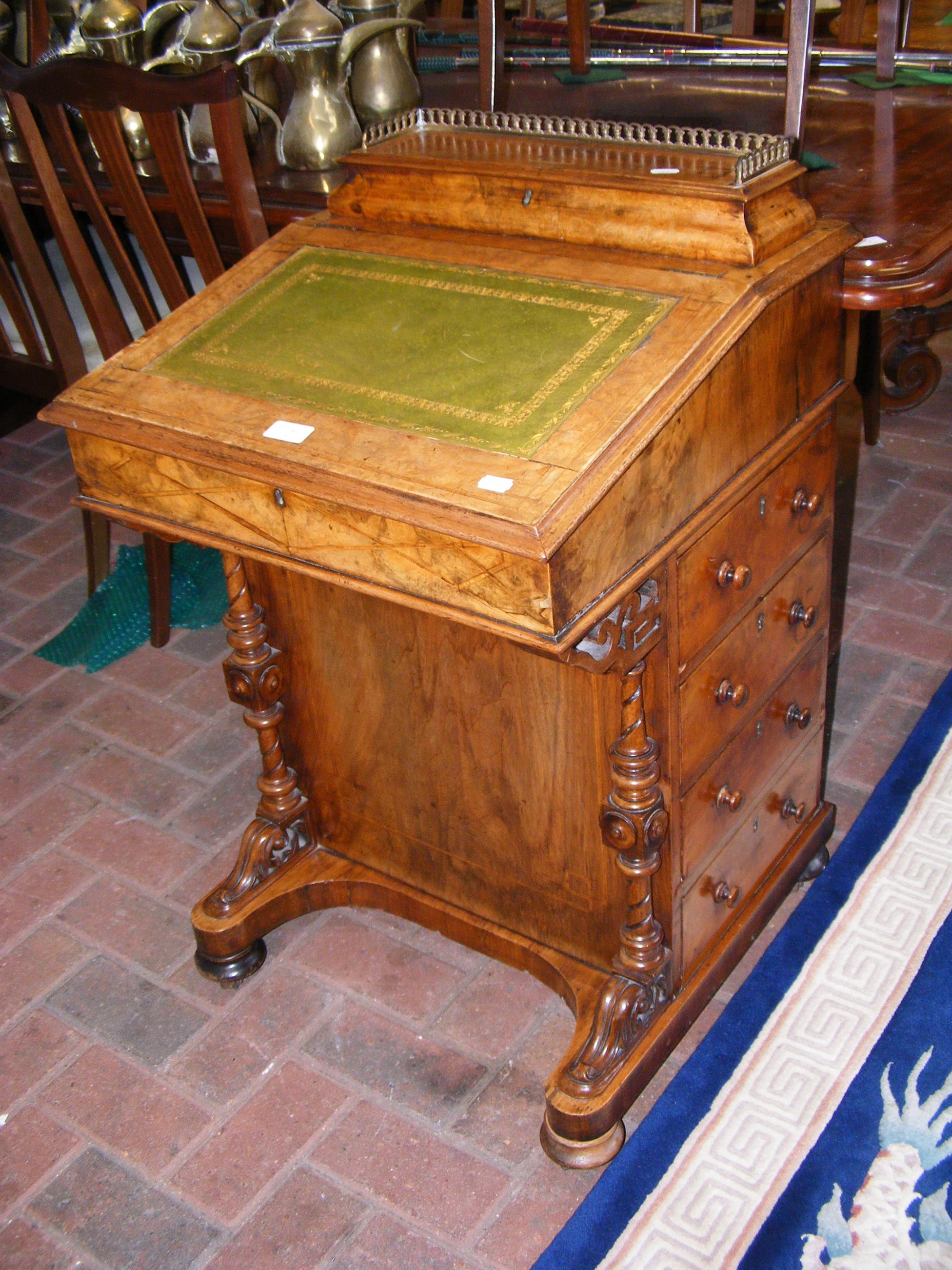 A Victorian burr walnut Davenport desk with four d