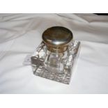 A silver top glass inkwell, the top engraved 'From