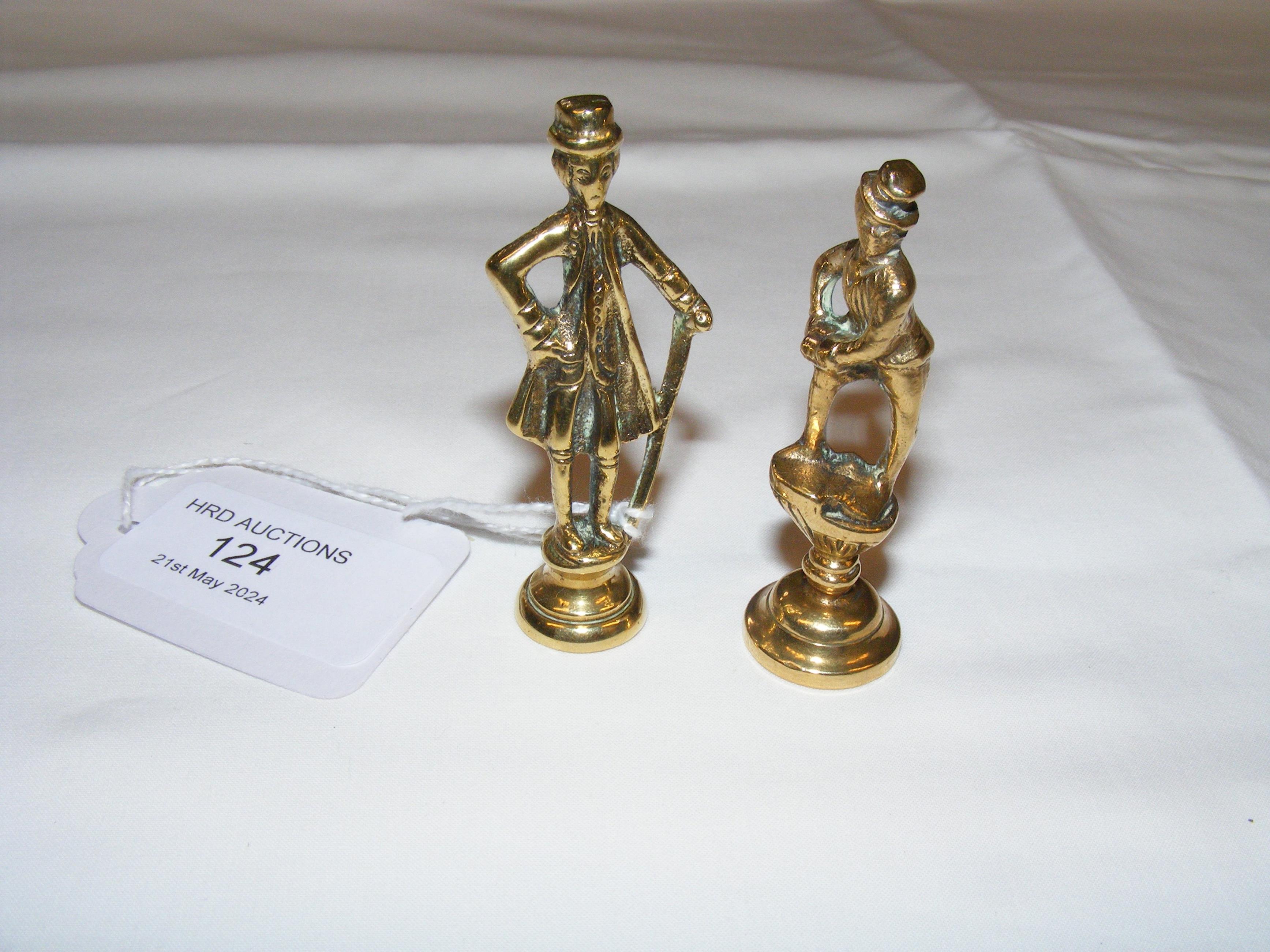 A pair of 5.5cm high brass pipe tampers - Fagin an