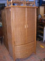 A cane and bamboo fronted wardrobe - width 99cm