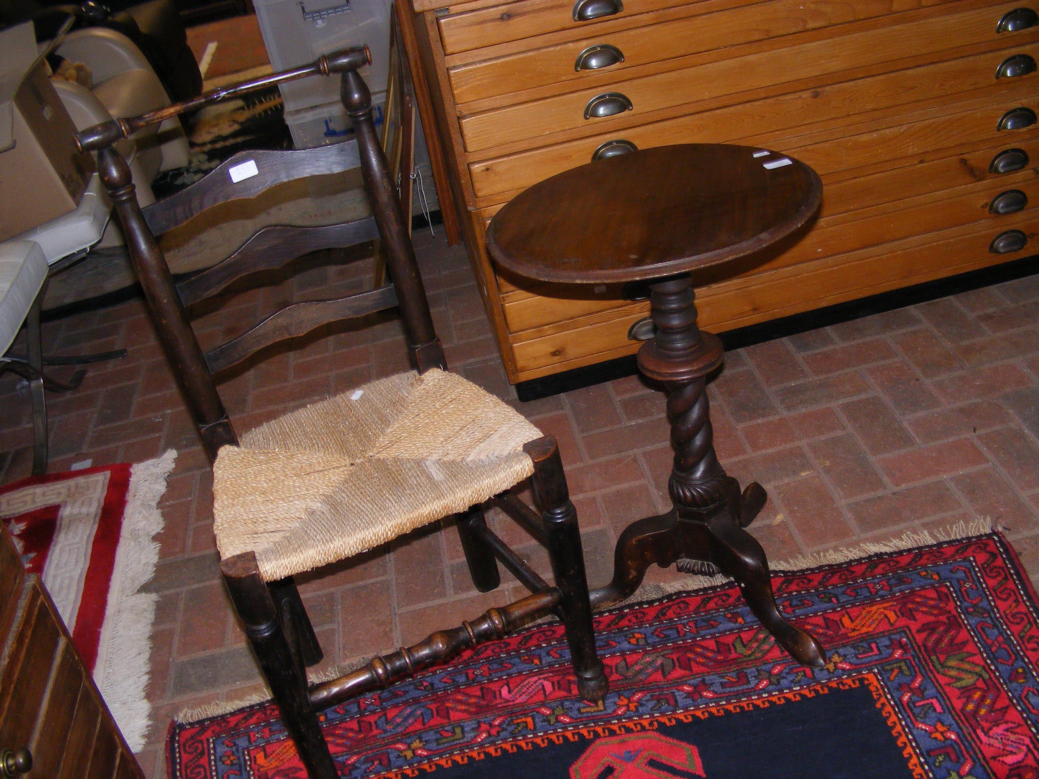 A wine table together with ladder back chair