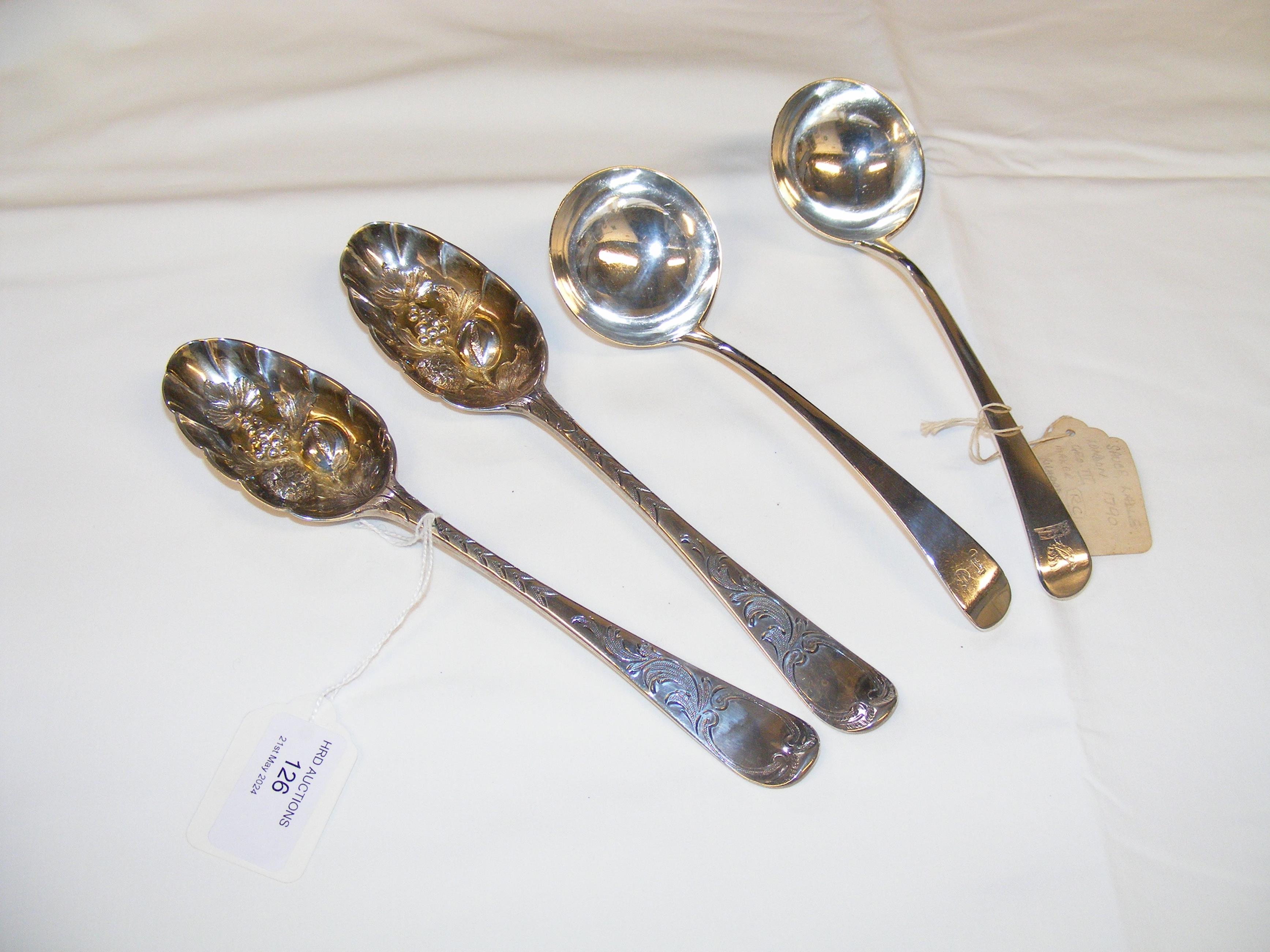 A pair of silver berry spoons, together with two s