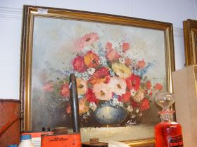 An oil on canvas of still life flowers - signed ST