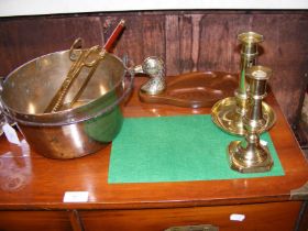 An antique brass preserve pan, chamberstick, etc.