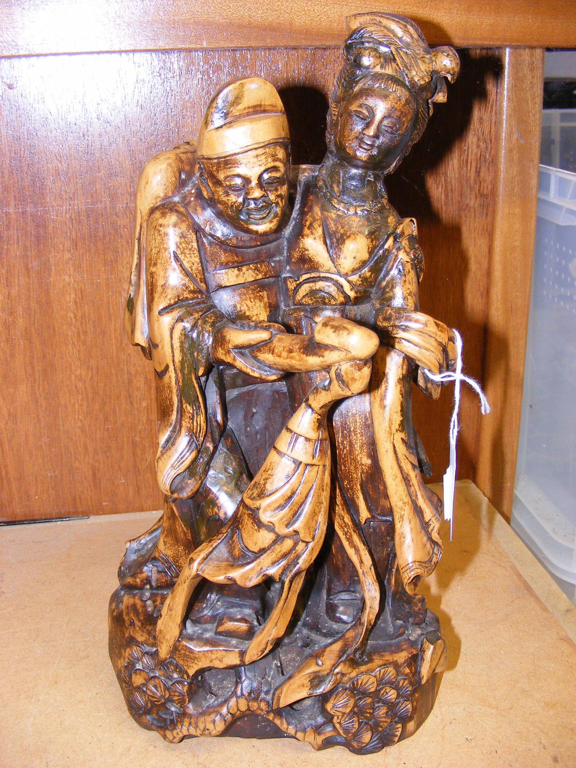 An oriental carved figural group