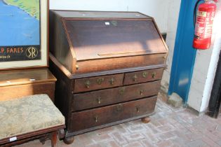 A Georgian country bureau with three drawers below