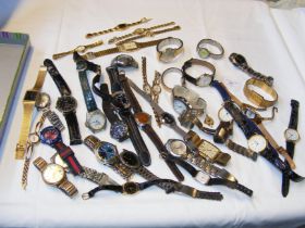 A tray containing gents and ladies wrist watches