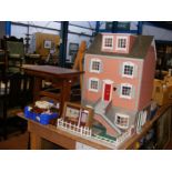 A four storey doll's house with front garden, toge