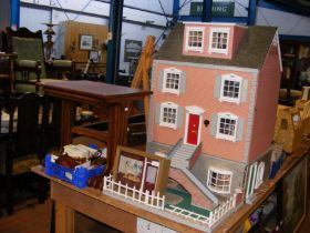 A four storey doll's house with front garden, toge