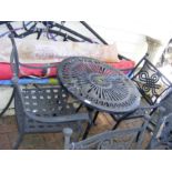 A black and metal bistro garden table with two cha