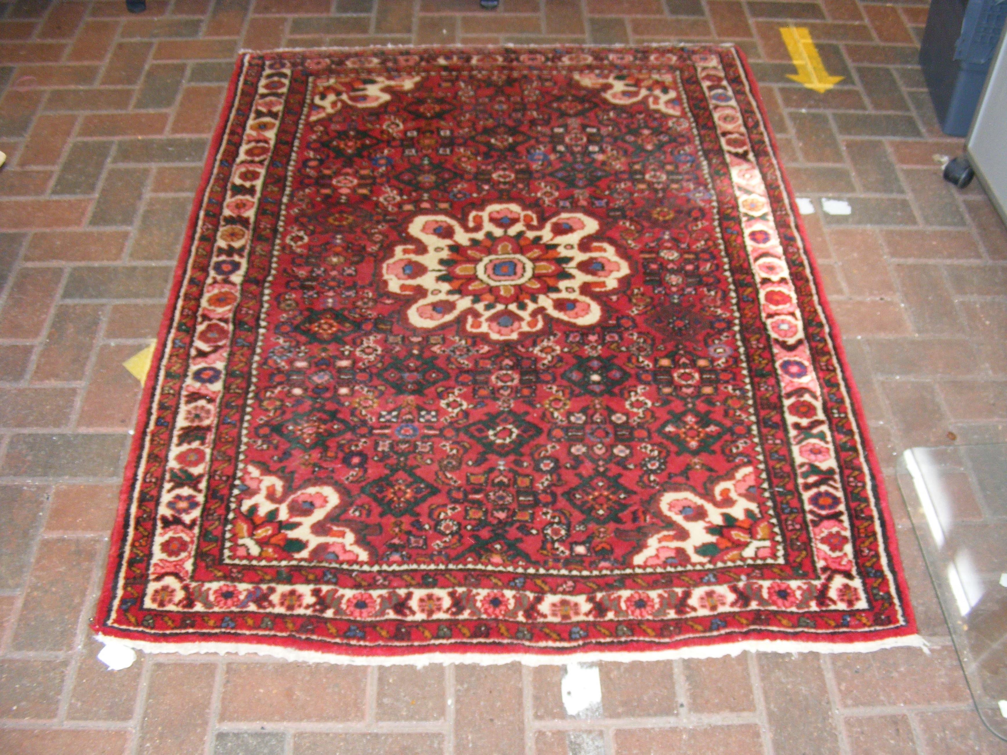 A small Middle Eastern rug with geometric border -