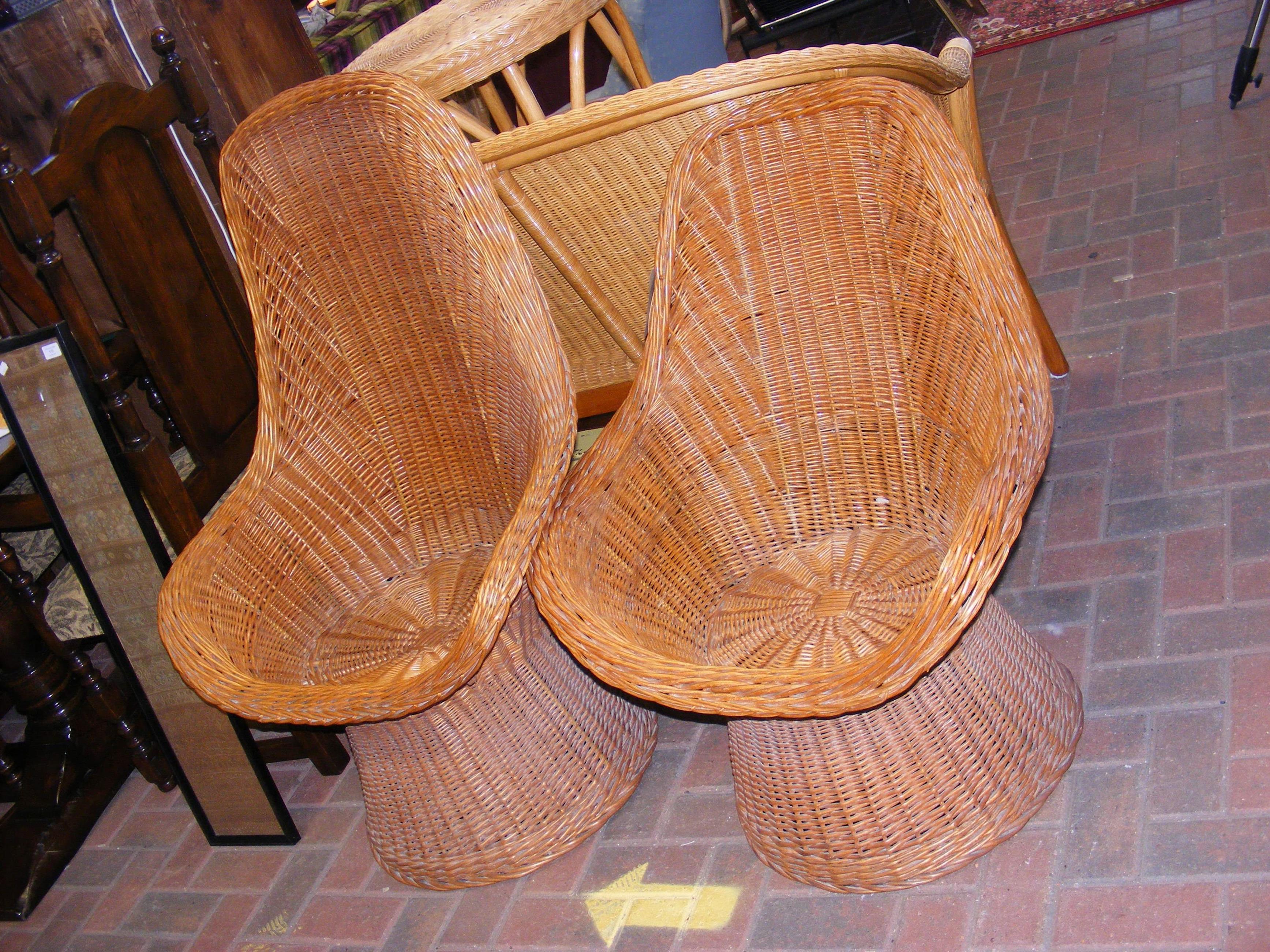 Two vintage rattan high back basket chairs