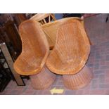 Two vintage rattan high back basket chairs