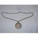 A silver mounted coin, 1780 on chain