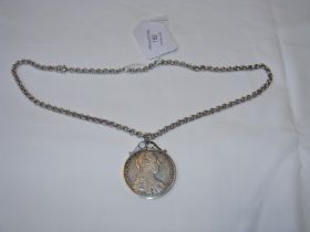 A silver mounted coin, 1780 on chain