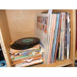 A collection of vinyl LP and single records