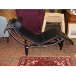 A retro chrome and black leatherette lounge reclin