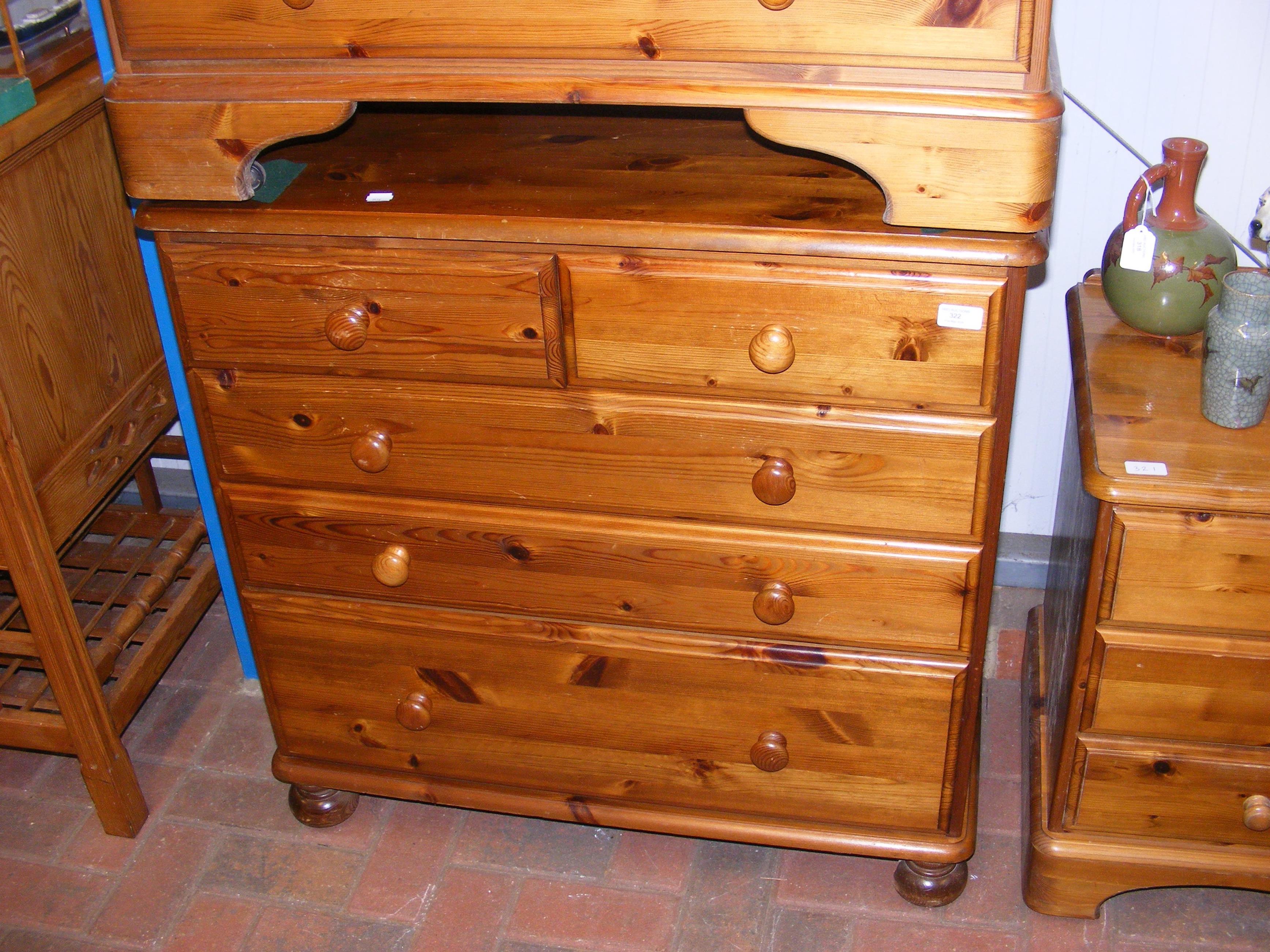 A lacquered pine chest of two short and three long
