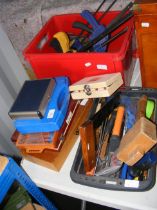 A red box with clamps, selection of other boxed an