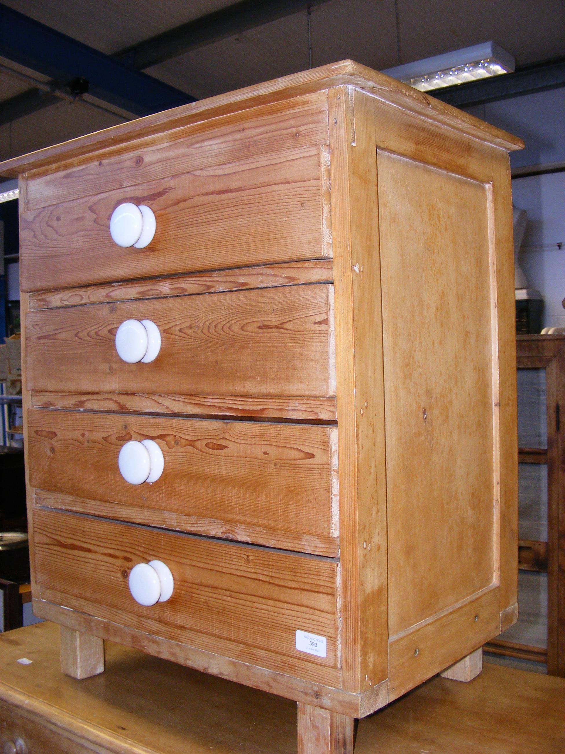 A stripped pine chest of four drawers - width 61cm