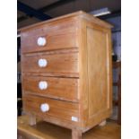 A stripped pine chest of four drawers - width 61cm