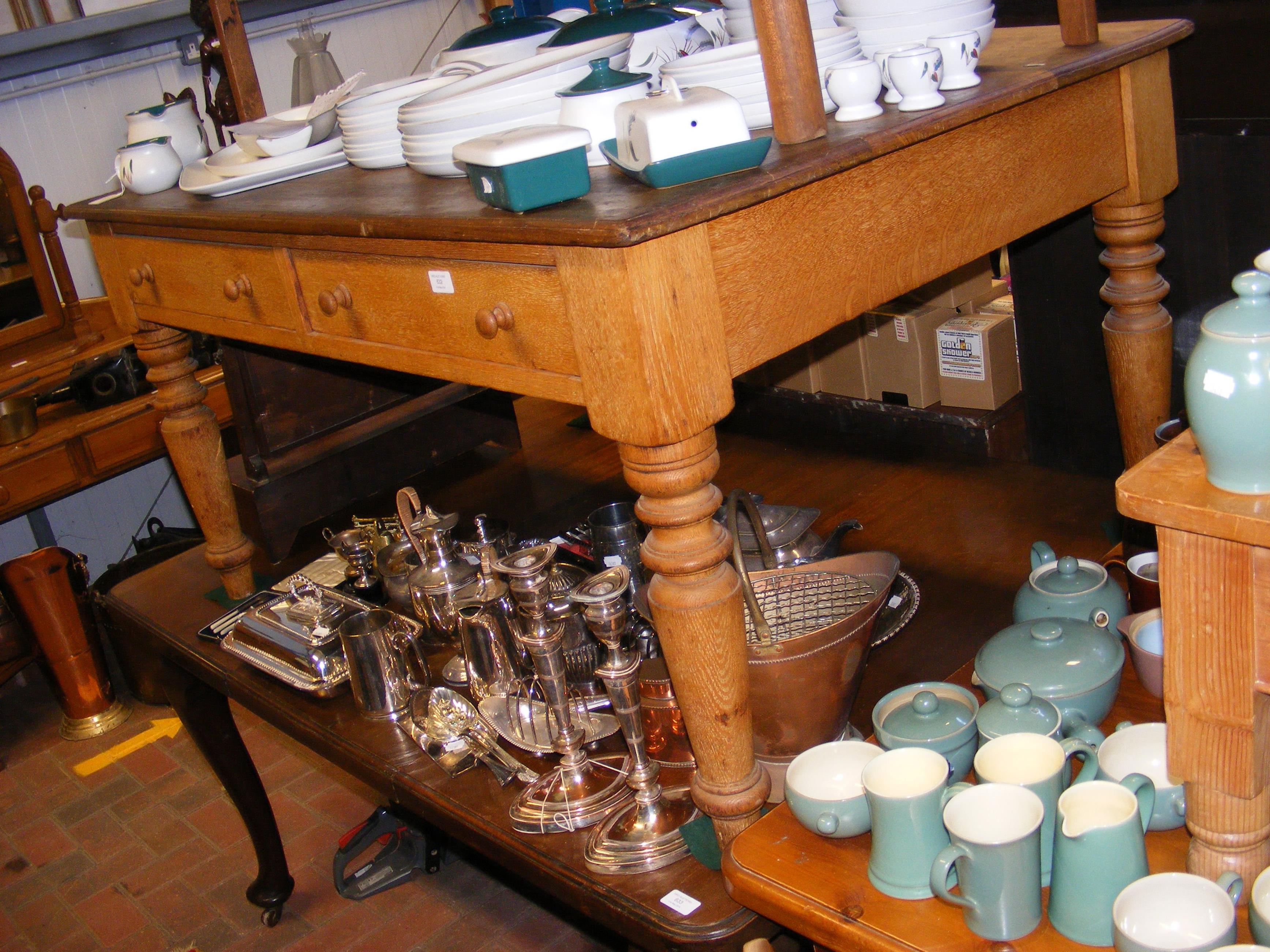 A farmhouse kitchen table with side by side drawer