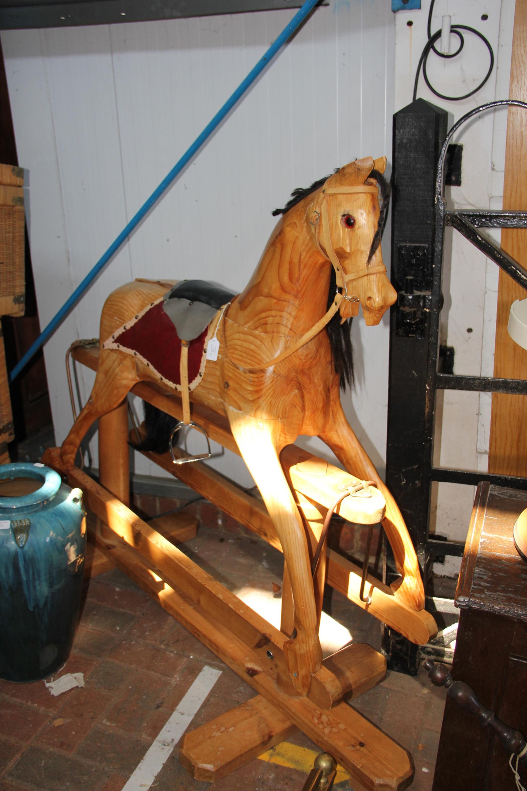 A 130cm high wooden rocking horse