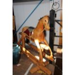 A 130cm high wooden rocking horse