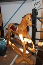 A 130cm high wooden rocking horse