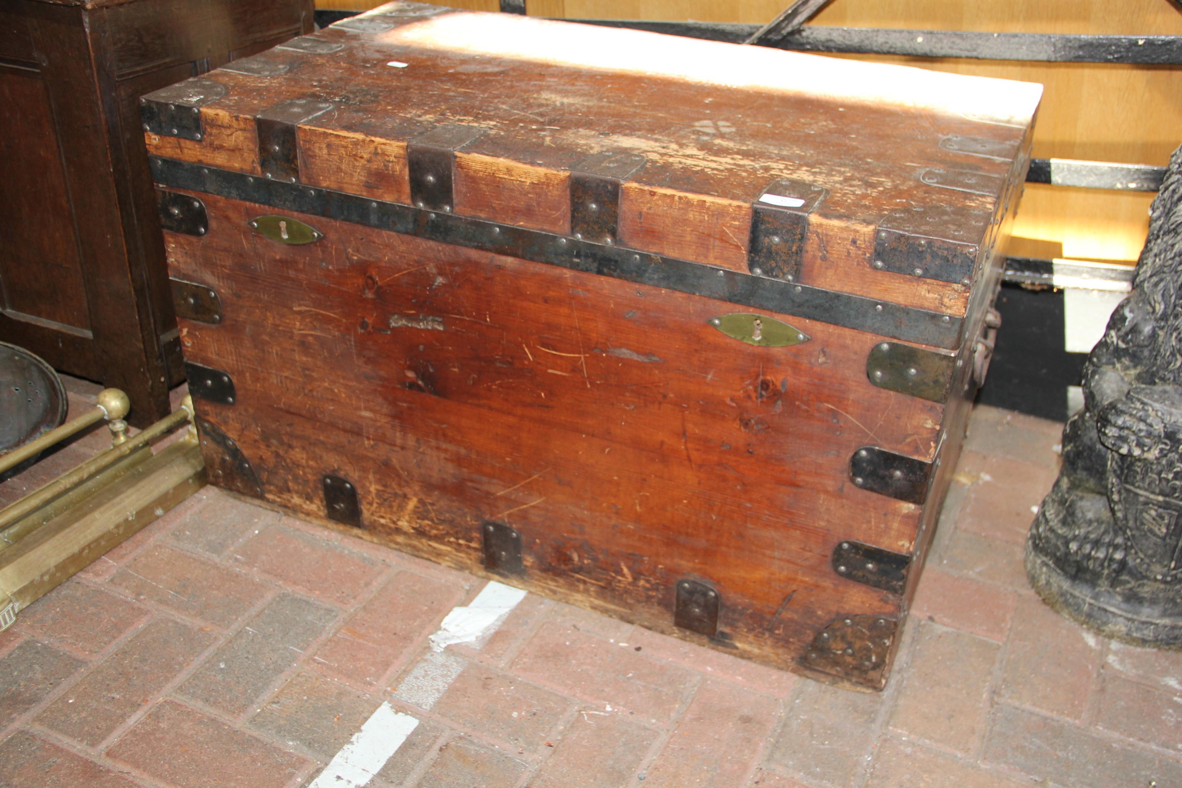 An antique chest with metal mounts