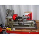 A Myford bench mounted lathe with manual etc.