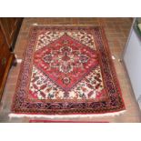 A Middle Eastern rug with geometric border - 135cm