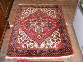 A Middle Eastern rug with geometric border - 135cm