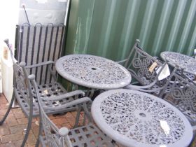 A black and metal bistro garden table with two cha